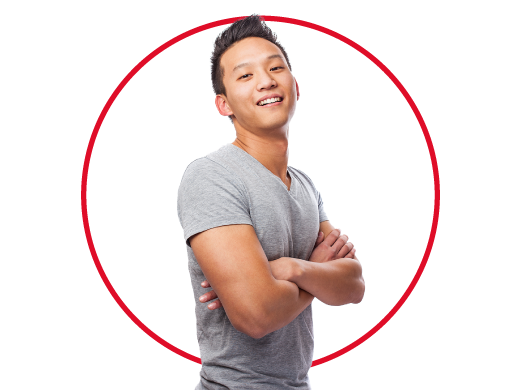 Relieved young man wearing red tracksuit smiling cheerfully